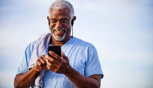Senior using a refurbished smartphone with large text enabled