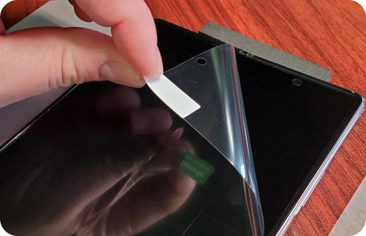 Technician inspecting a refurbished Samsung Galaxy display