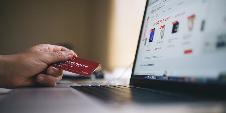 Customer shopping for a refurbished phone online on a laptop