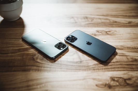 Flat lay of refurbished iPhones and Samsung Galaxy phones on a table
