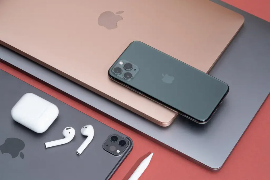 Certified refurbished iPhone, iPad, and MacBook on desk — 2025 guide